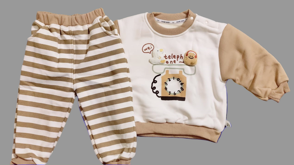 Children's outfit with striped pants and a sweatshirt on a blue background